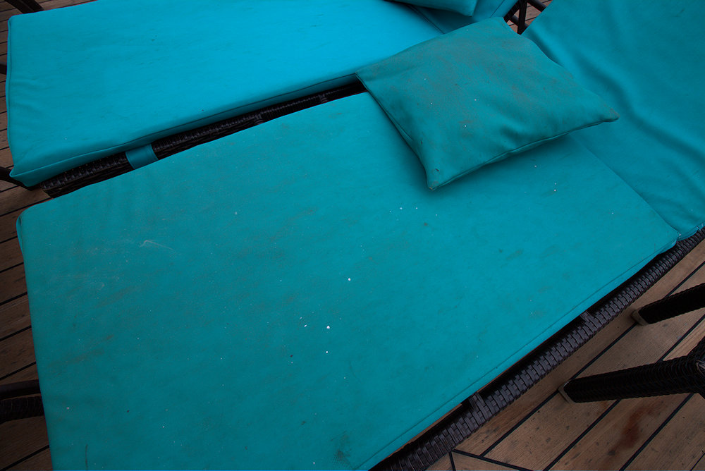 Dirty lounger pads on Lido deck