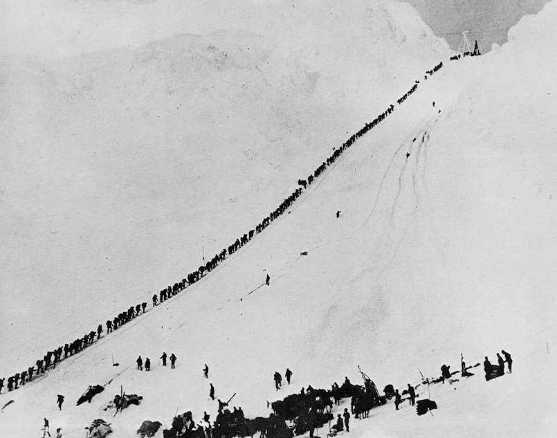 1898 photo of gold miners climbing mount Chilkoot Alaska