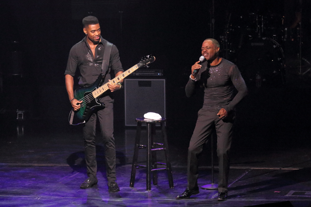 singer Kenny James and his son, Trevor, playing bass