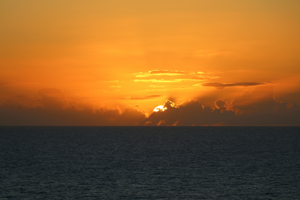 Sunset as seen from the balcony of a cruise ship