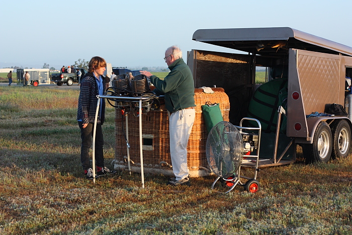Rick Wallace sets up his hot air balloon with grandson Alex Kinsinger