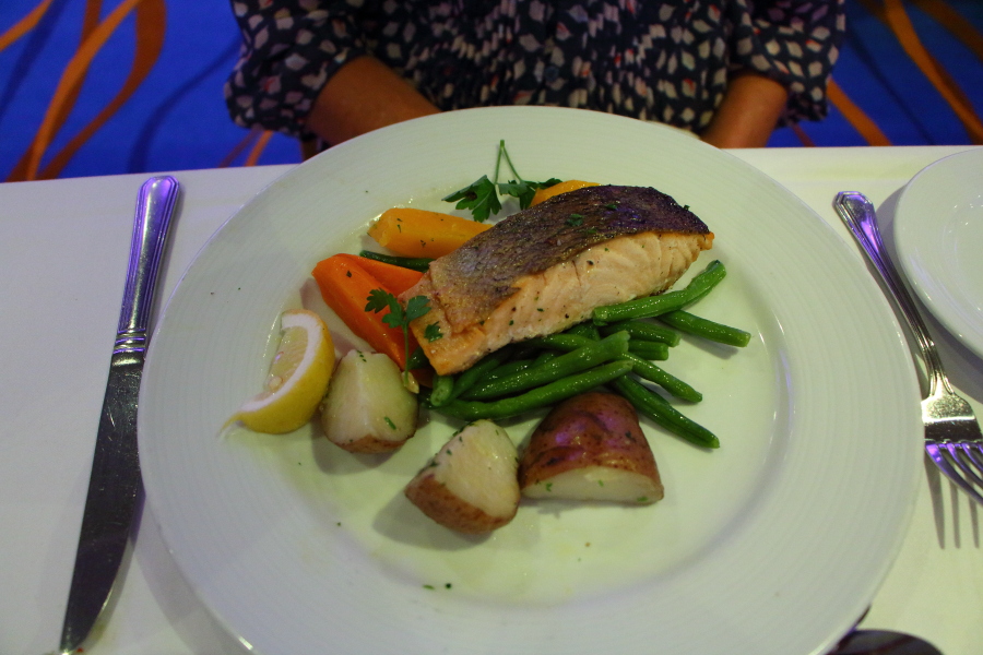 Salmon dinner in the Sapphire dining room on Carnival Breeze