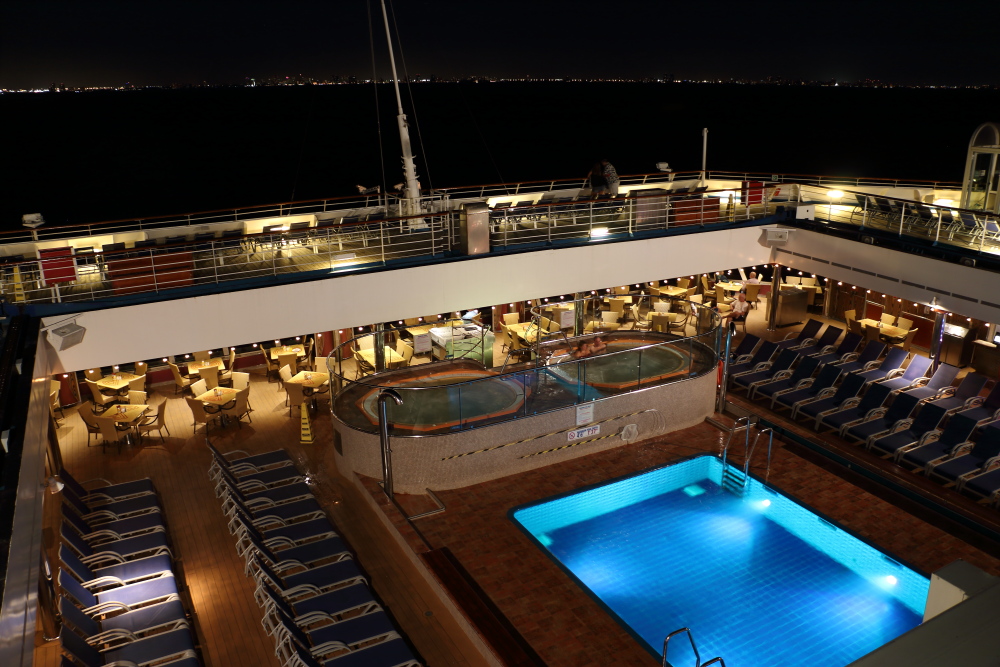 Carnival Freedom aft pool at night with dome open