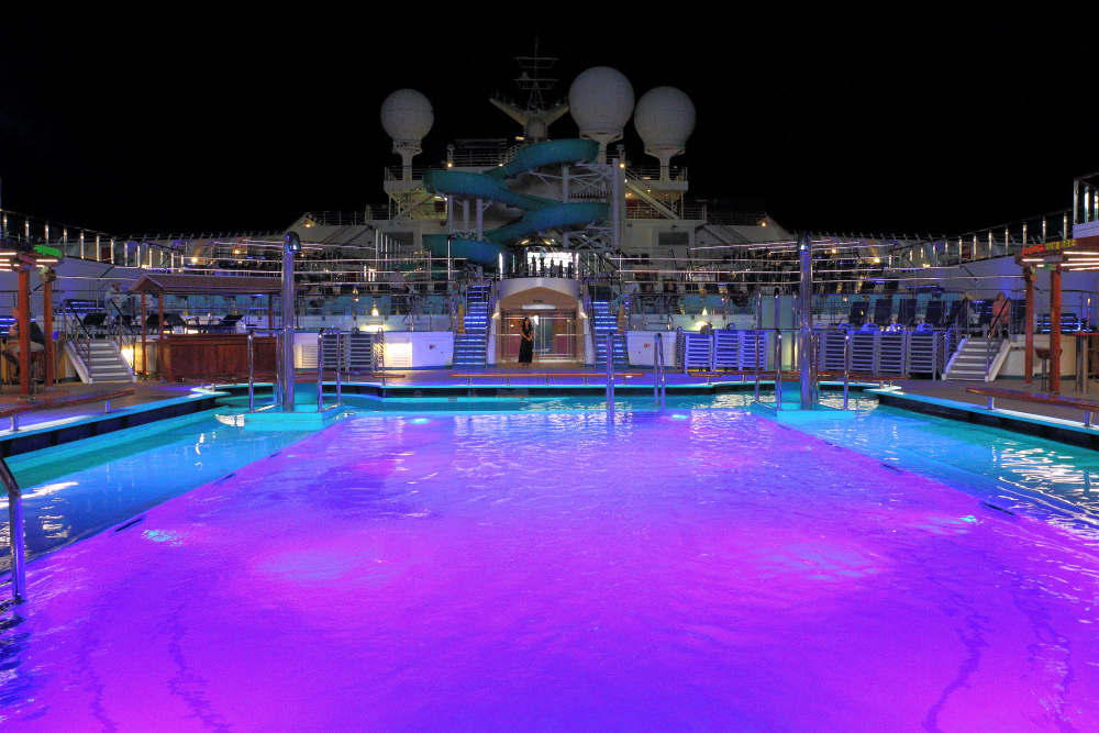 Carnival Freedom swimming pool at night