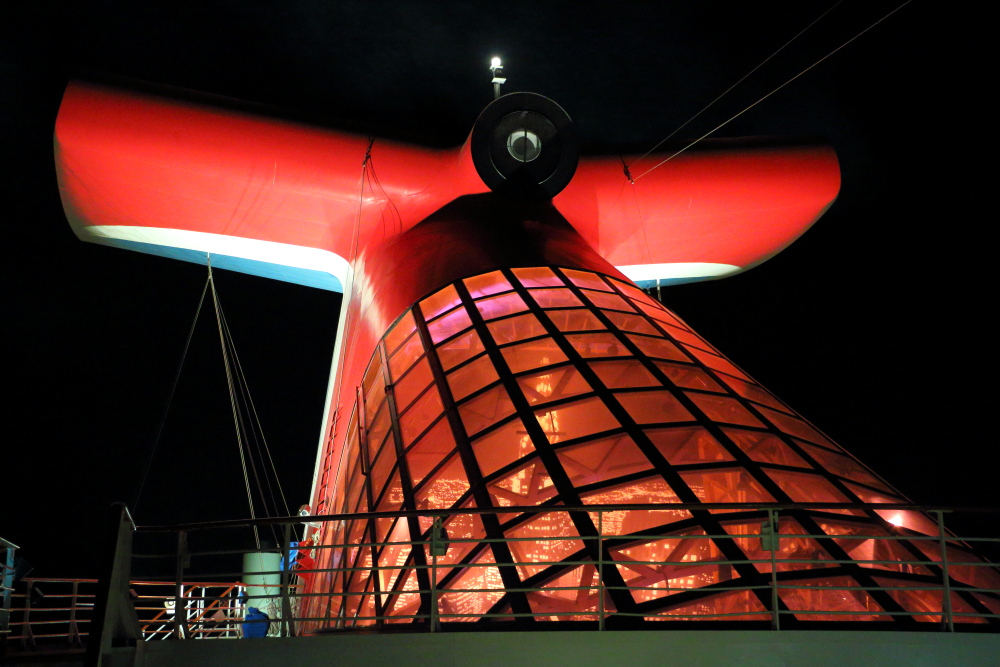 Carnival Miracle funnel at night