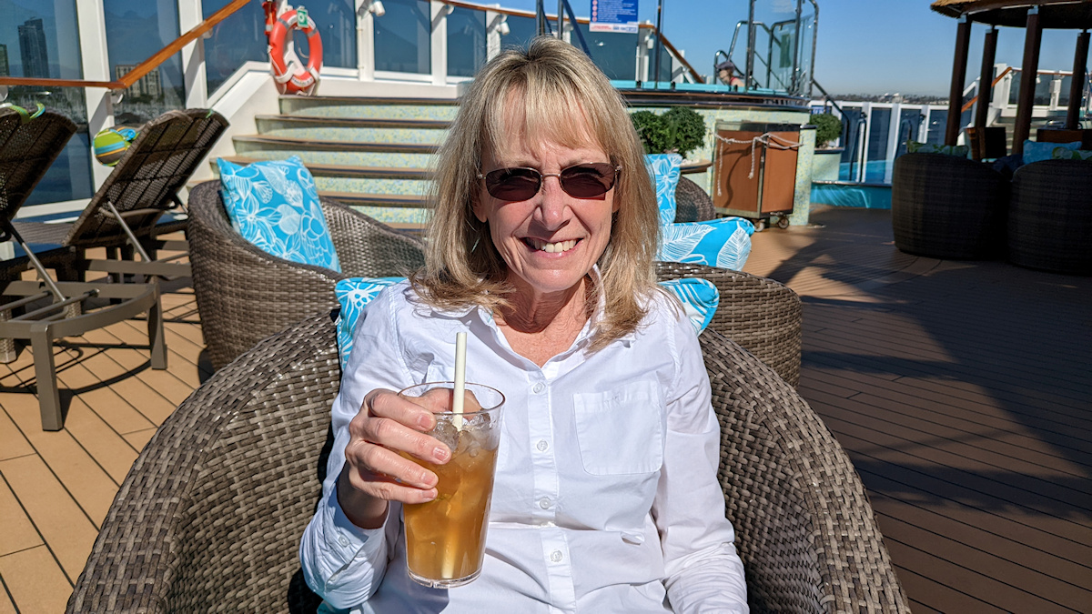 Kellyn with a cocktail in the Havana sun deck