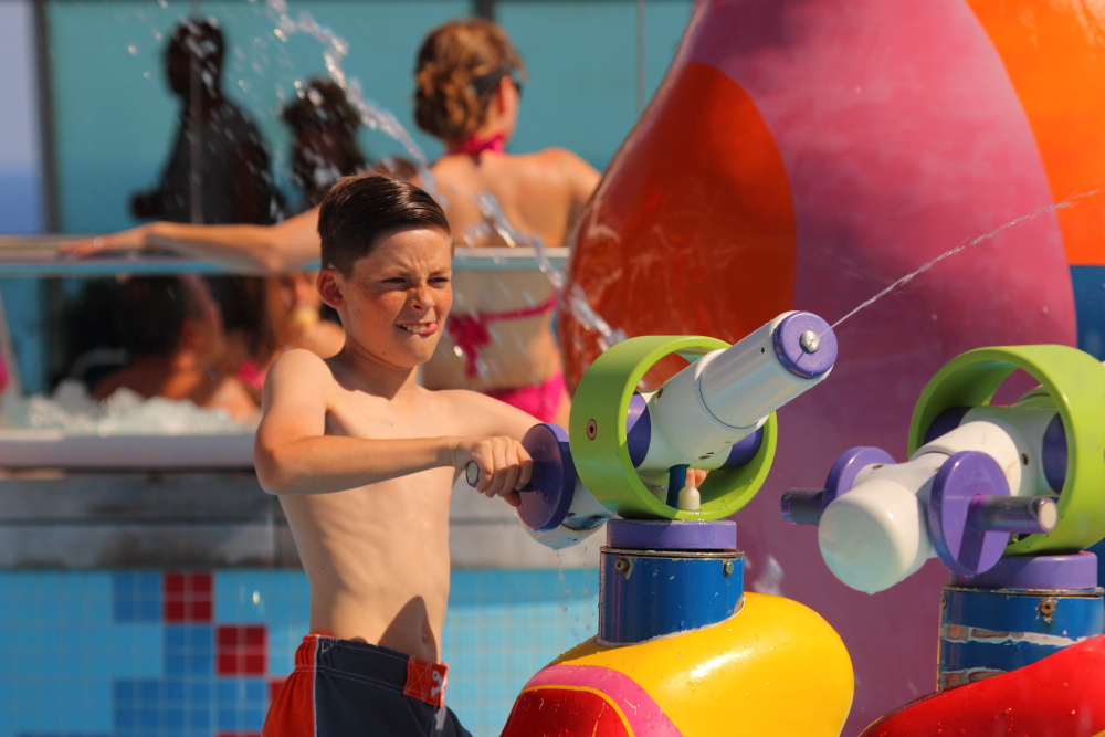 boy having fun at Independence Of The Seas water park
