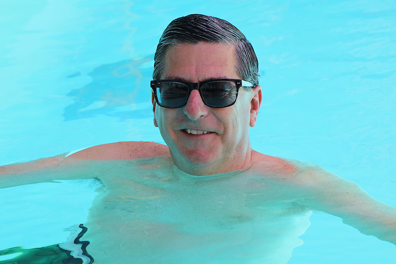 Jim Zimmerlin with sunglasses in swimming pool