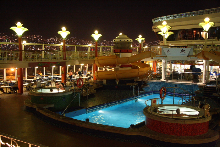 Photo of the Norwegian Star pool deck at night