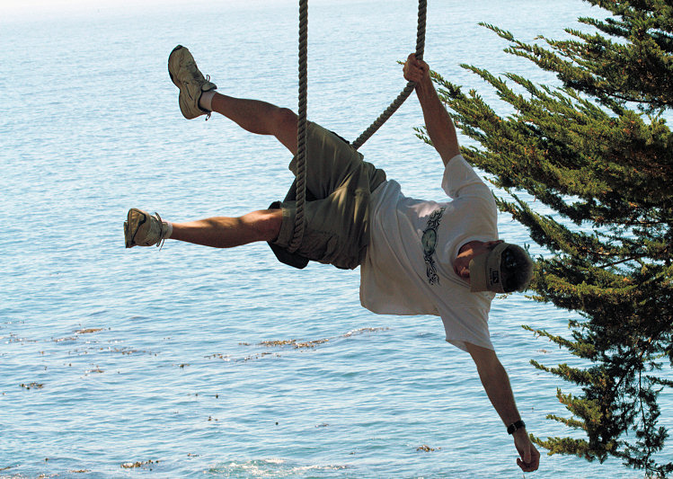clowning around on a rope swing