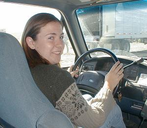 Sheri driving a Ford pickup truck